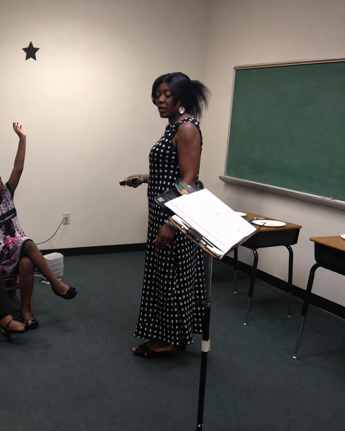 Sebrina Petterson teaching a class, engaging with a raised hand